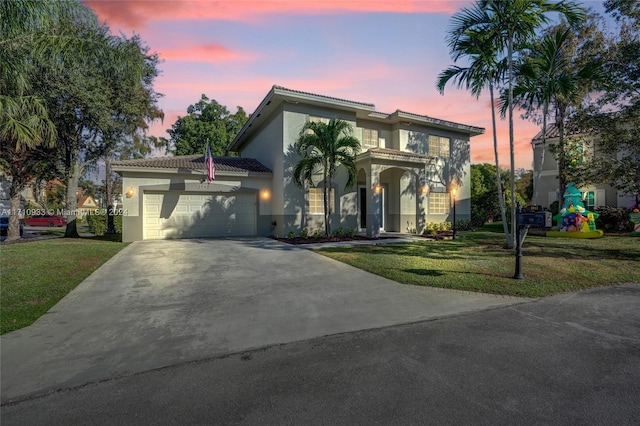 view of front facade featuring a yard and a garage