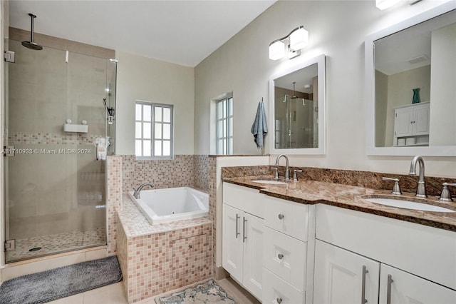 bathroom featuring tile patterned floors, vanity, and separate shower and tub