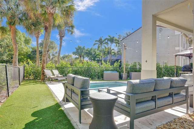 view of patio / terrace featuring a fenced in pool and an outdoor hangout area