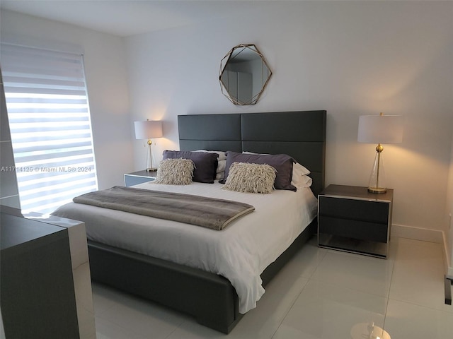 bedroom with light tile patterned flooring