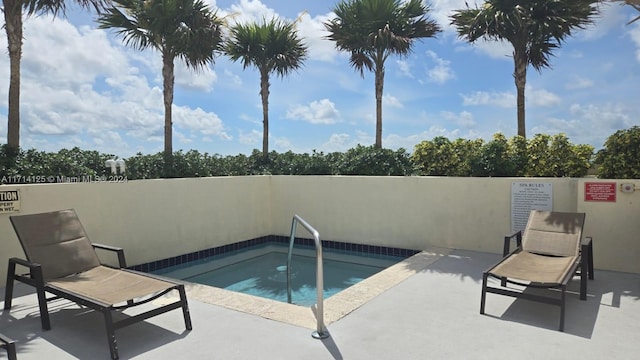 view of pool featuring a community hot tub