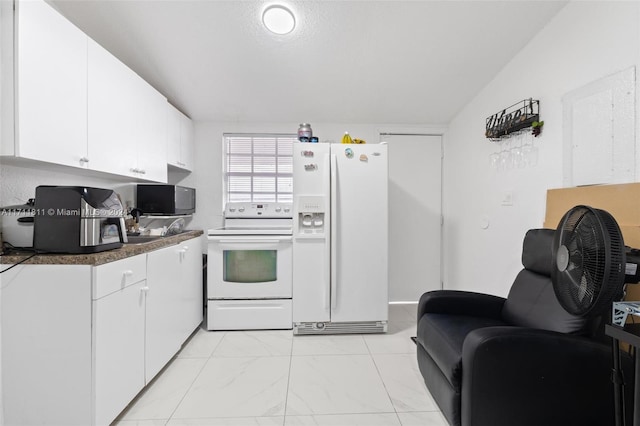 kitchen with white cabinetry and white appliances