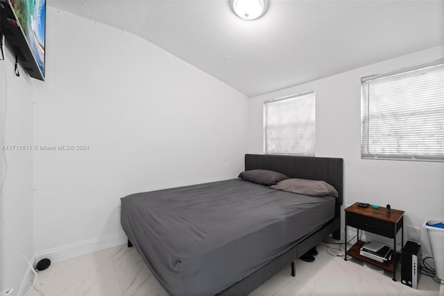 bedroom with vaulted ceiling