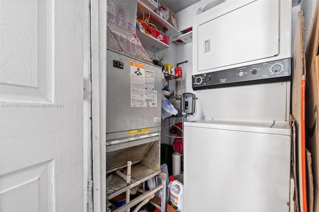 washroom featuring stacked washing maching and dryer