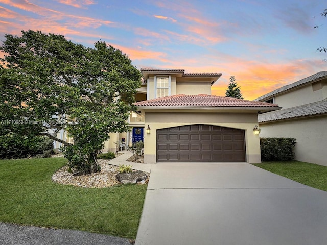 mediterranean / spanish home with a lawn