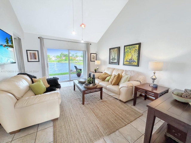 living room with light tile patterned flooring and high vaulted ceiling