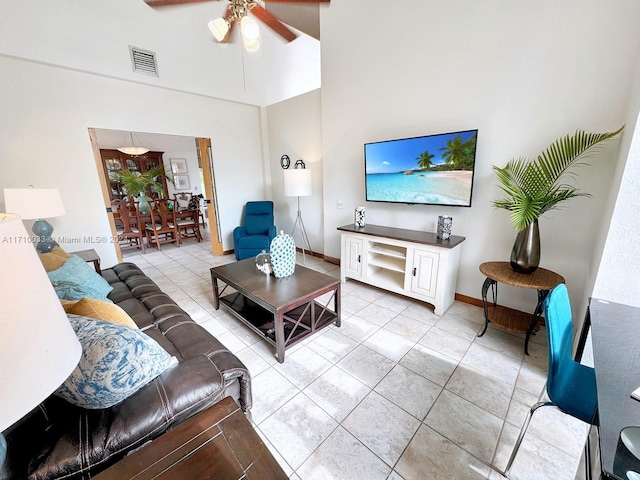 living room featuring ceiling fan and light tile patterned floors