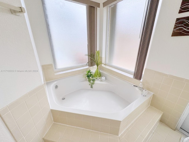 bathroom featuring tiled bath