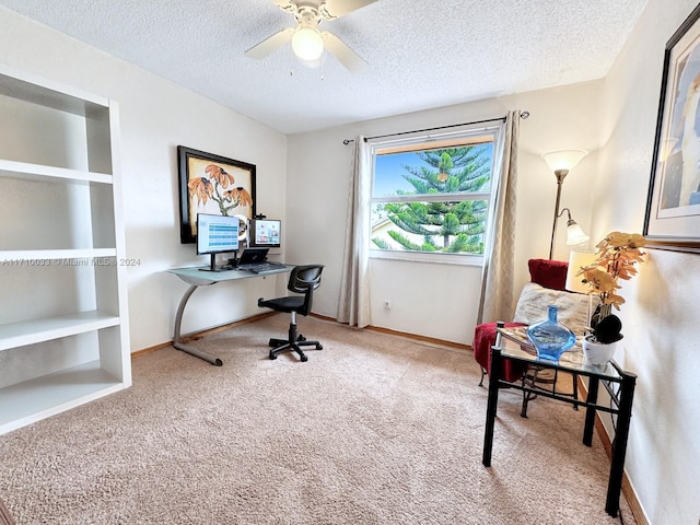 carpeted office featuring ceiling fan, built in features, and a textured ceiling