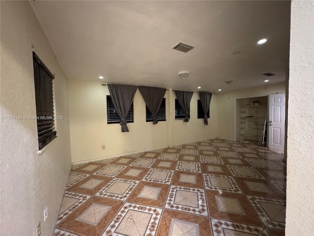 empty room with tile patterned flooring