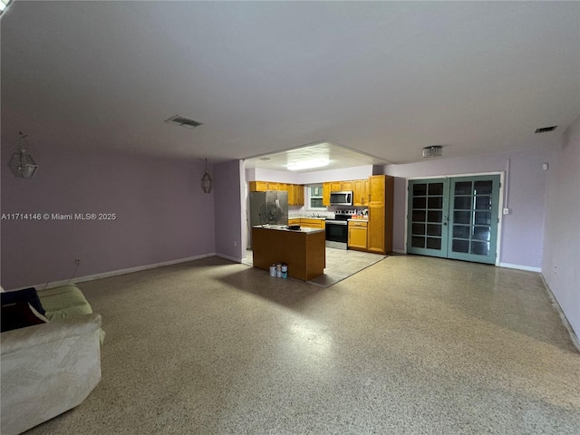 unfurnished living room with french doors