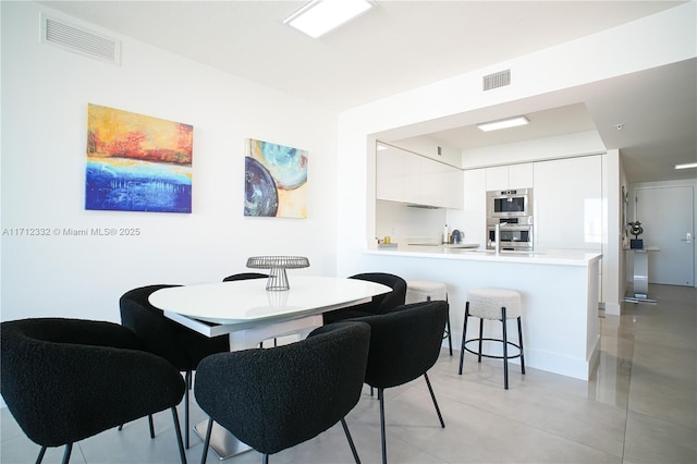 dining room featuring sink