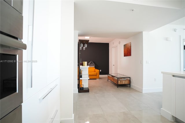 hallway with light tile patterned floors