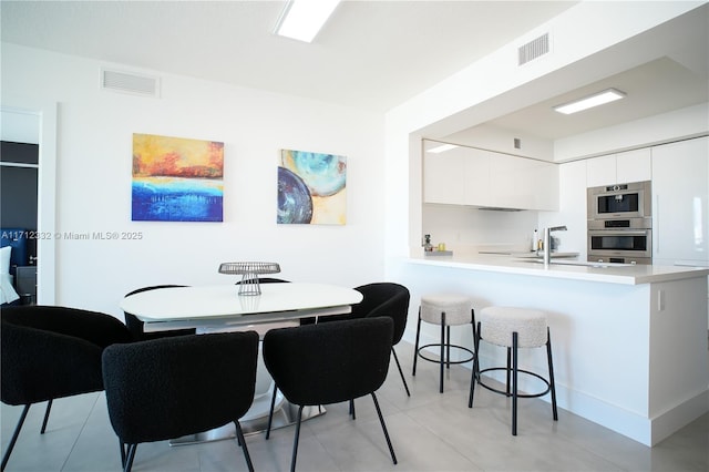 dining space featuring sink