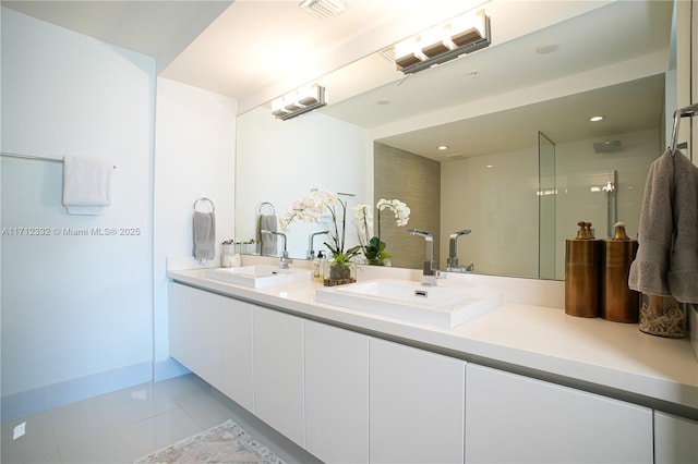 bathroom featuring tile patterned floors and vanity