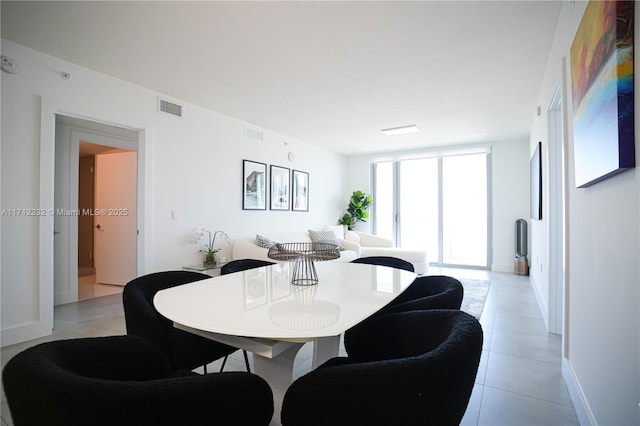 dining space with floor to ceiling windows