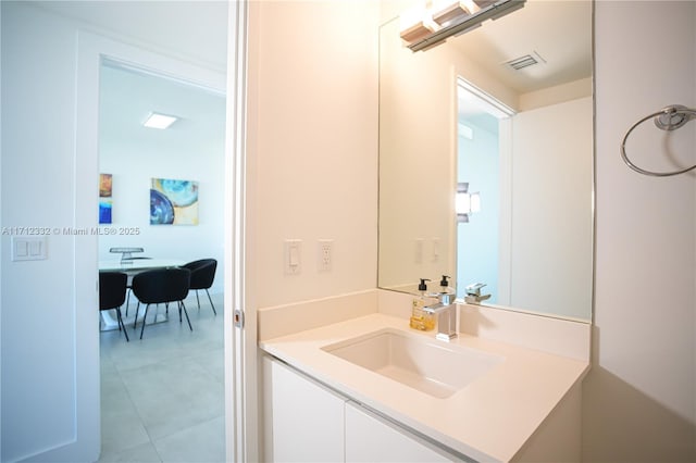 bathroom with tile patterned floors and vanity