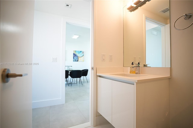 bathroom featuring tile patterned floors and vanity