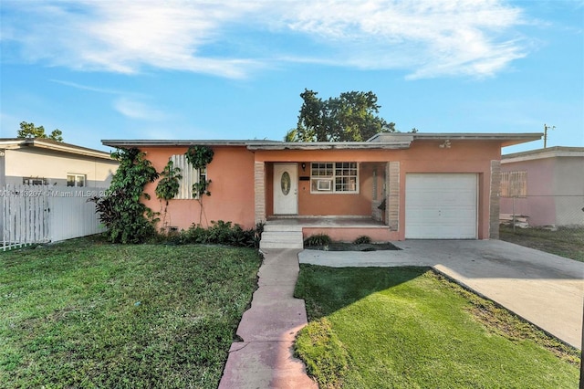 single story home with a garage and a front yard