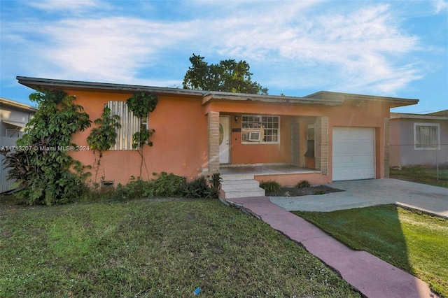 view of front of property with a porch, a garage, and a front yard