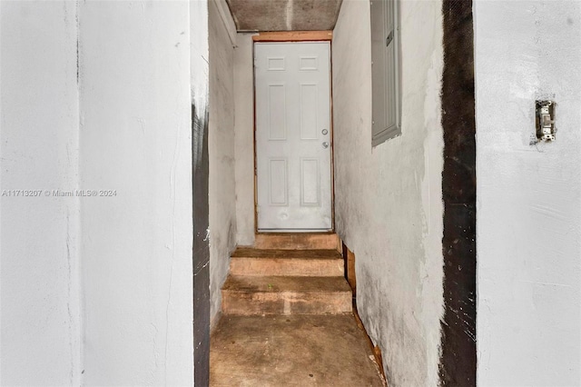 stairway featuring concrete flooring