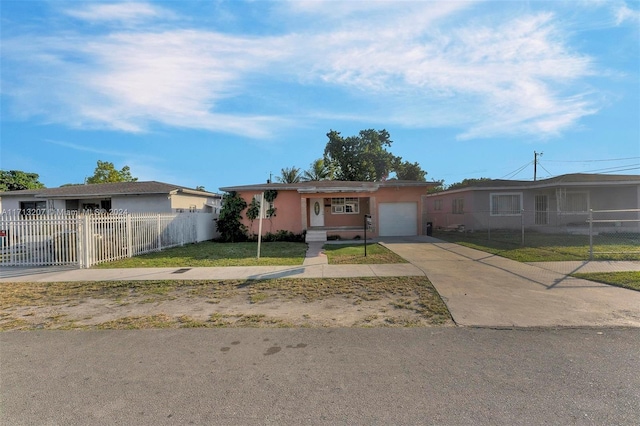 ranch-style home with a front lawn and a garage