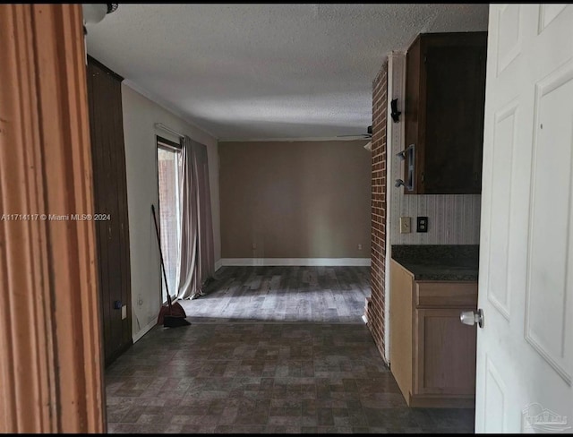 hallway featuring a textured ceiling