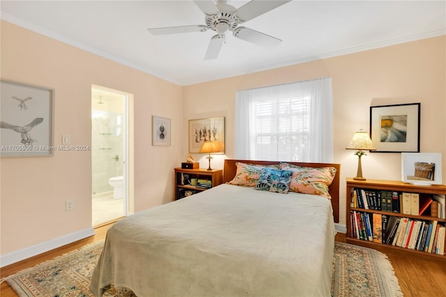 bedroom featuring hardwood / wood-style flooring, ensuite bathroom, and ceiling fan