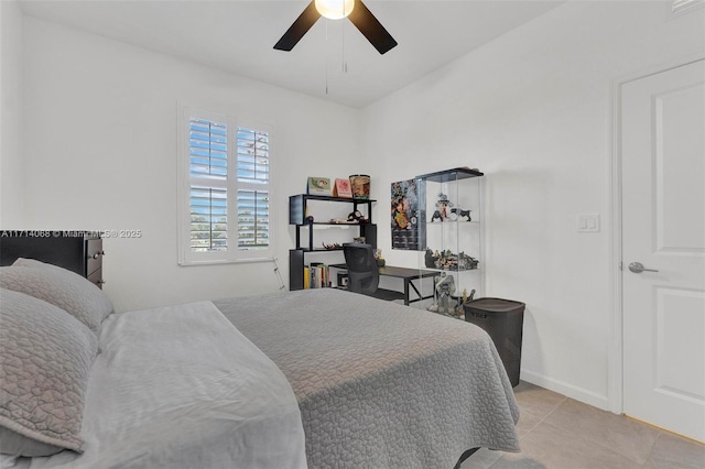 tiled bedroom with ceiling fan