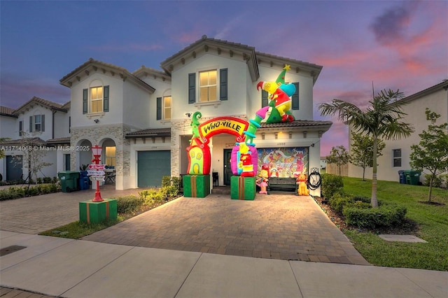 mediterranean / spanish-style house featuring a garage