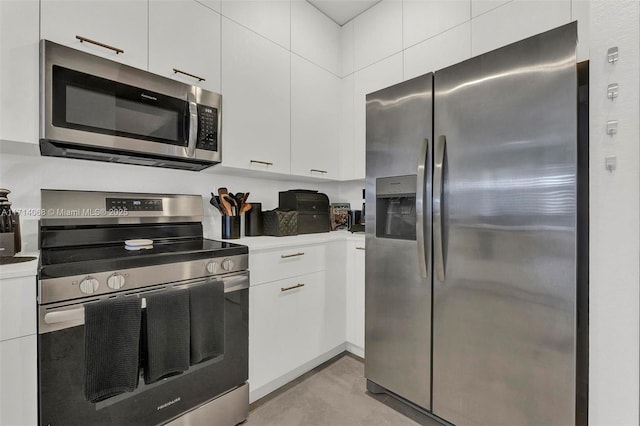 kitchen with white cabinetry and appliances with stainless steel finishes