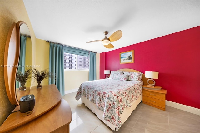 tiled bedroom with ceiling fan