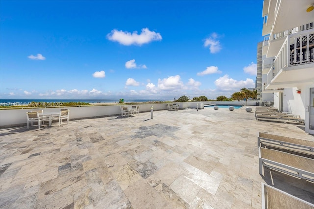 view of patio / terrace with a water view