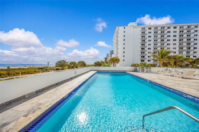 view of swimming pool with a patio area