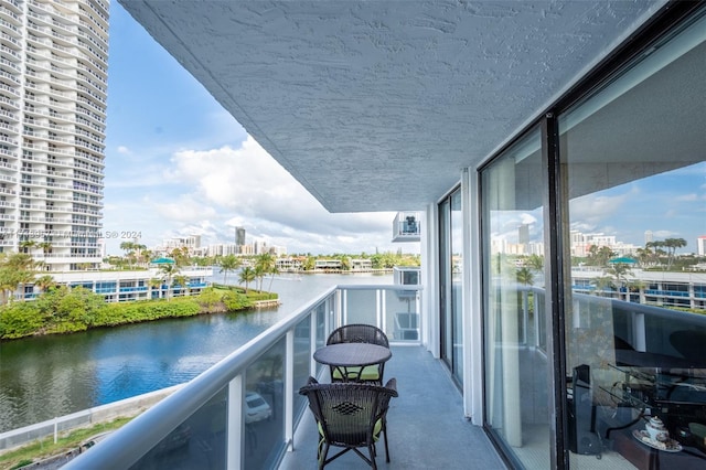 balcony featuring a water view