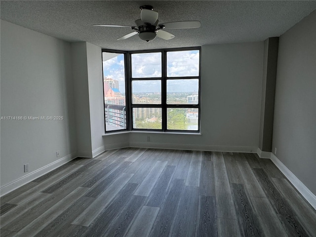 3530 Mystic Pointe Dr Unit 2602, Aventura, FL 33180 - empty room featuring dark wood-style flooring, a textured ceiling, and a ceiling fan