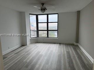 unfurnished room featuring ceiling fan