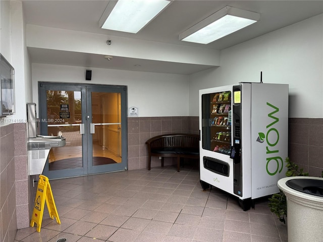 interior space with tile walls