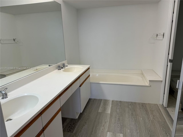 3530 Mystic Pointe Dr Unit 2602, Aventura, FL 33180 - bathroom with wood finished floors, a garden tub, and double vanity