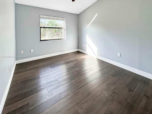 empty room featuring dark hardwood / wood-style flooring