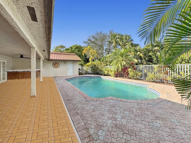 view of swimming pool with a patio area