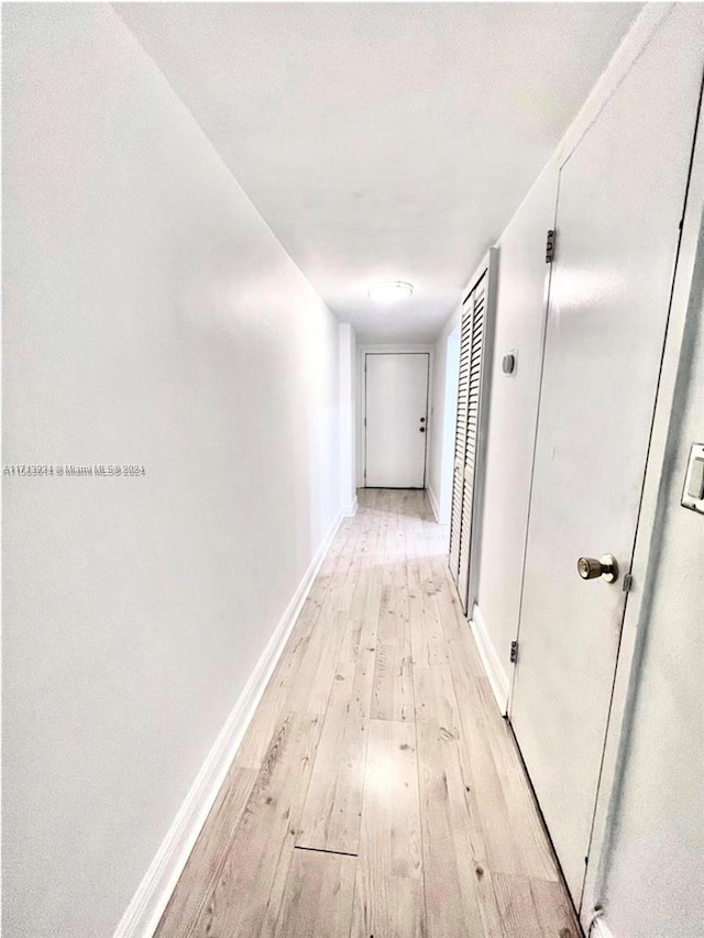 hallway featuring light wood-type flooring