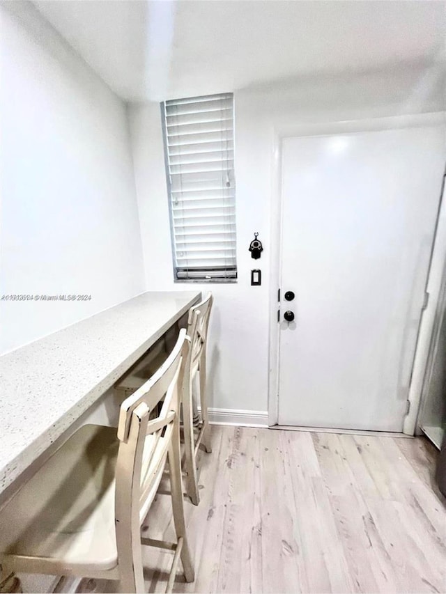 laundry room featuring light hardwood / wood-style flooring