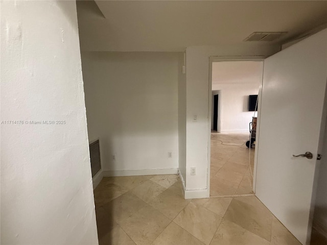 hallway featuring light tile patterned floors