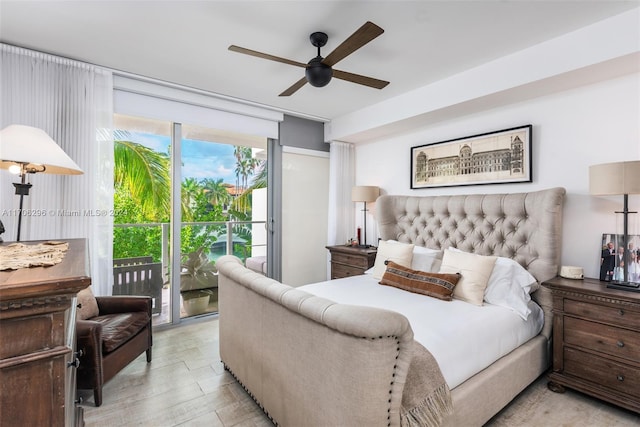 bedroom featuring ceiling fan, light wood-type flooring, a wall of windows, and access to outside