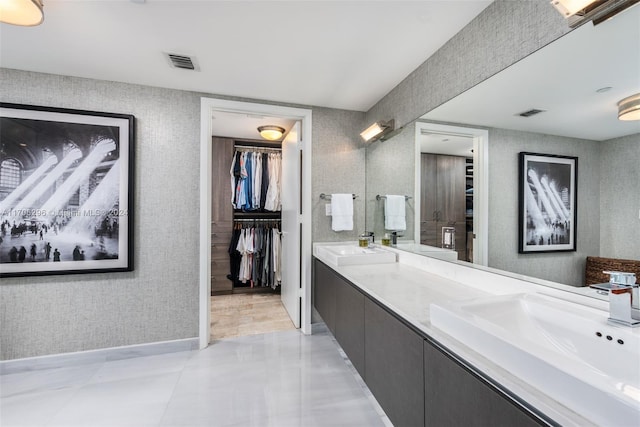 bathroom featuring tile patterned floors and vanity