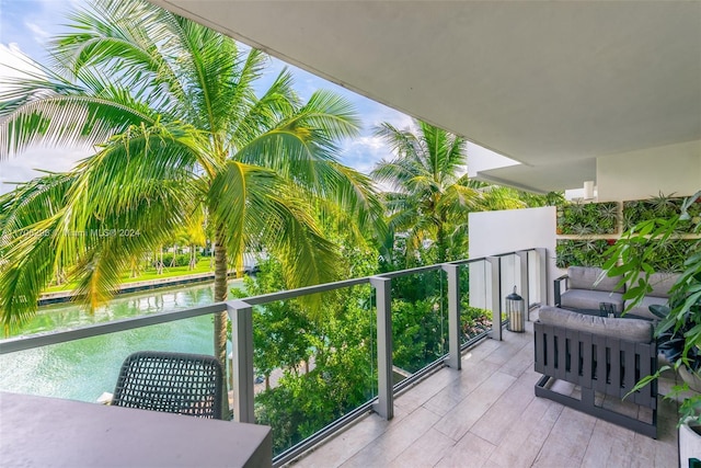 balcony featuring a water view