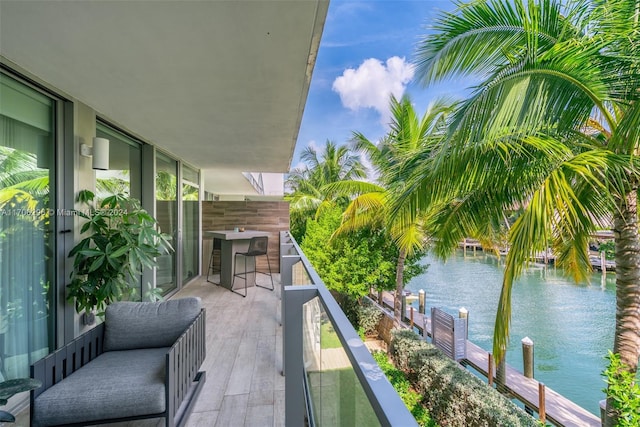 balcony featuring a water view