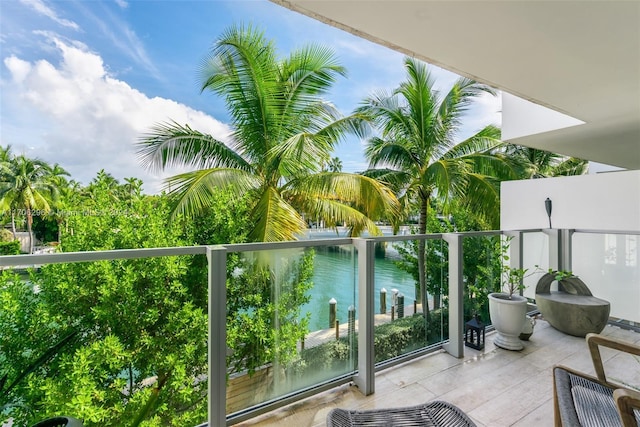 balcony featuring a water view