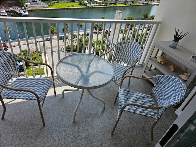 balcony featuring a water view